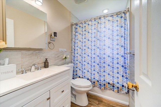 26 Booth Blvd, Wappingers Falls, NY 12590 - bathroom featuring vanity, toilet, wood finished floors, decorative backsplash, and shower / tub combo