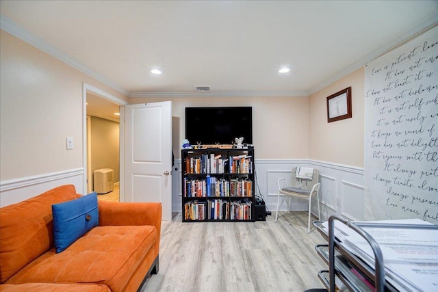 26 Booth Blvd, Wappingers Falls, NY 12590 - living area featuring wood finished floors, ornamental molding, a wainscoted wall, and recessed lighting