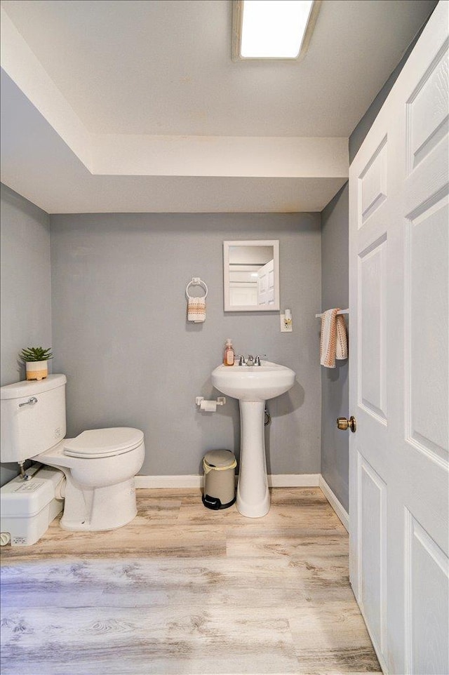26 Booth Blvd, Wappingers Falls, NY 12590 - half bathroom with toilet, wood finished floors, and baseboards