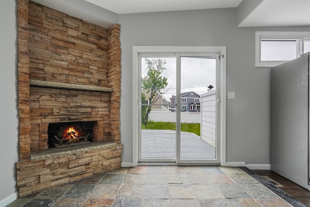 3061 Xavier Ct, Oceanside, NY 11572 - entryway with stone tile flooring, healthy amount of natural light, and baseboards