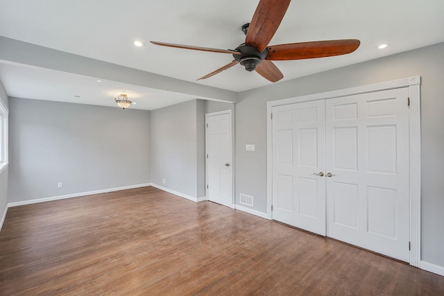 3061 Xavier Ct, Oceanside, NY 11572 - unfurnished bedroom with wood finished floors, recessed lighting, baseboards, a closet, and a ceiling fan