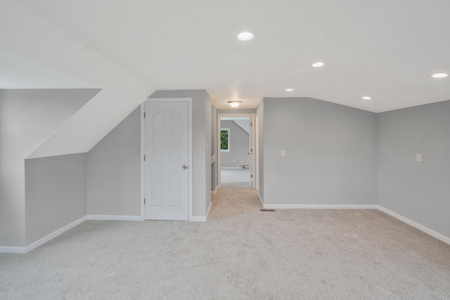 3061 Xavier Ct, Oceanside, NY 11572 - bonus room with light carpet, baseboards, recessed lighting, and lofted ceiling