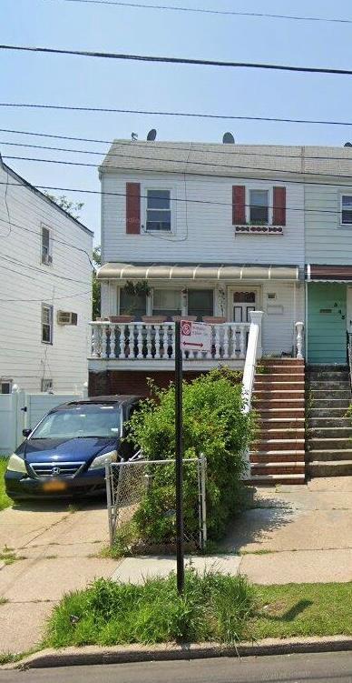 543 Bch 72nd St, Far Rockaway, NY 11692 - view of front facade with stairs and covered porch