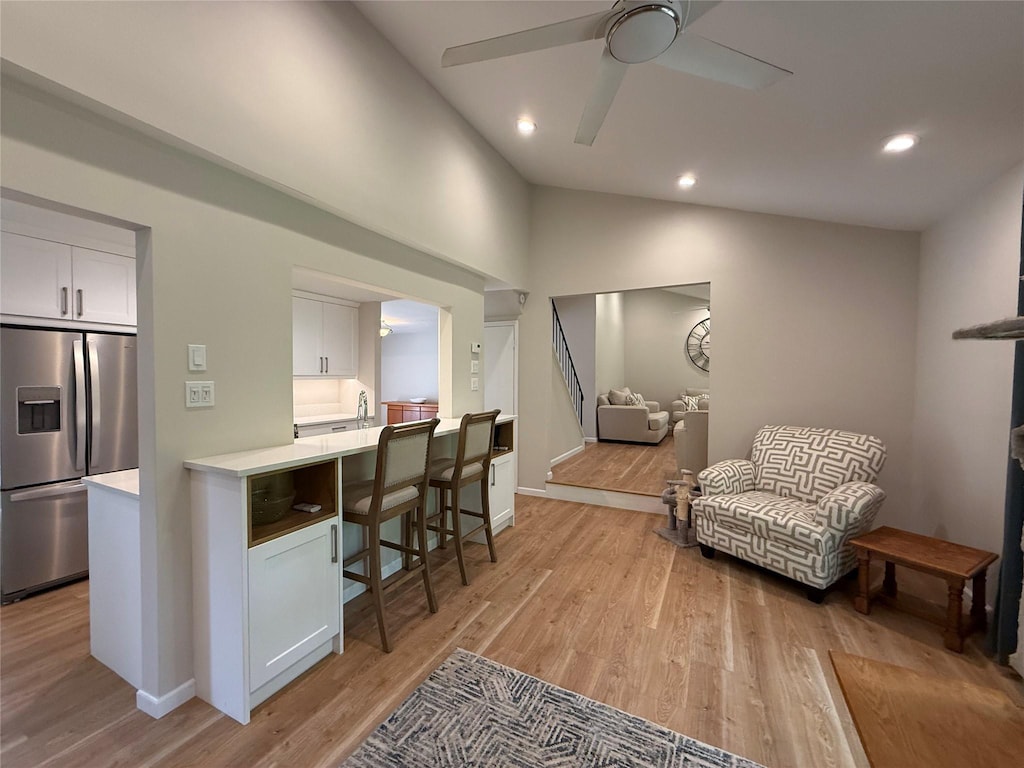 44 Woodbine St, Coram, NY 11727 - living area with a ceiling fan, light wood-style floors, vaulted ceiling, recessed lighting, and baseboards