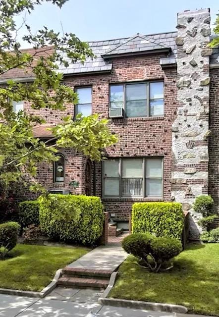 6472 84th St, Middle Village, NY 11379 - view of front of property featuring brick siding and a front yard