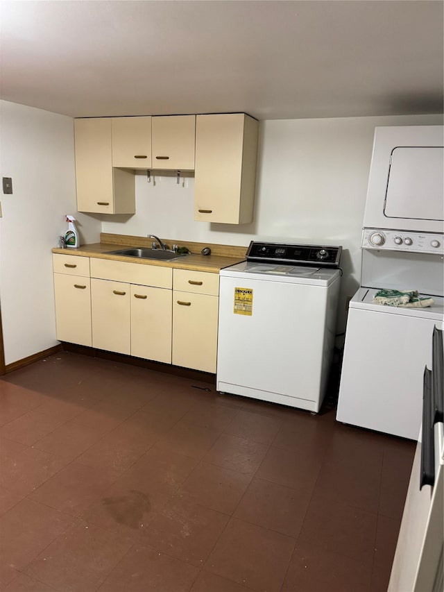 6472 84th St, Middle Village, NY 11379 - kitchen with stacked washer / dryer, cream cabinets, and light countertops