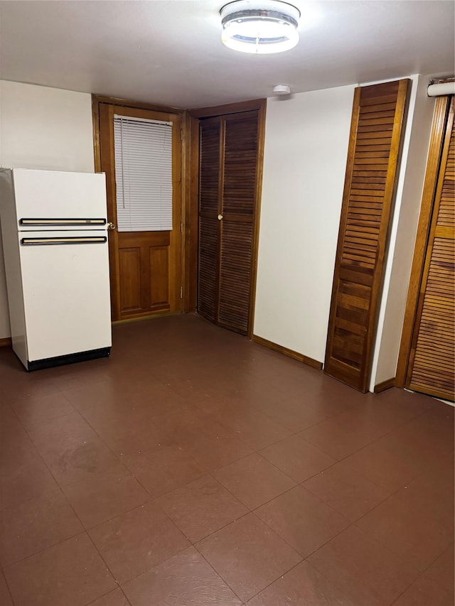 6472 84th St, Middle Village, NY 11379 - empty room with a smoke detector and baseboards