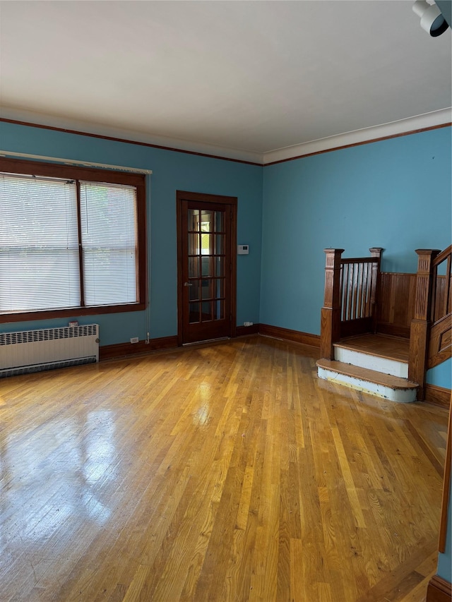 6472 84th St, Middle Village, NY 11379 - unfurnished room with radiator, light wood-type flooring, and ornamental molding
