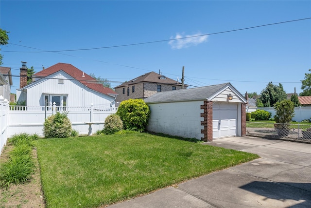 8123 260th St, Glen Oaks, NY 11004 - view of yard with a detached garage, an outbuilding, and concrete driveway
