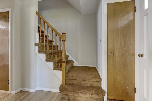 8123 260th St, Glen Oaks, NY 11004 - stairs featuring baseboards and wood finished floors