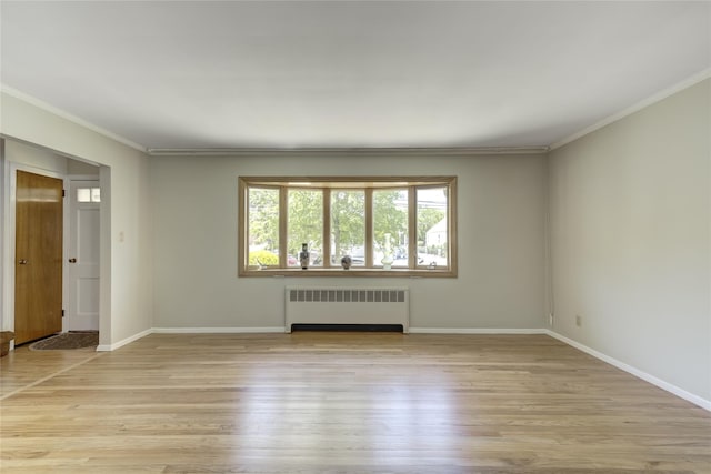 8123 260th St, Glen Oaks, NY 11004 - unfurnished room featuring radiator heating unit, light wood finished floors, crown molding, and baseboards