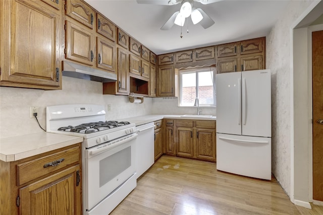 8123 260th St, Glen Oaks, NY 11004 - kitchen featuring white appliances, under cabinet range hood, a sink, brown cabinetry, and ceiling fan