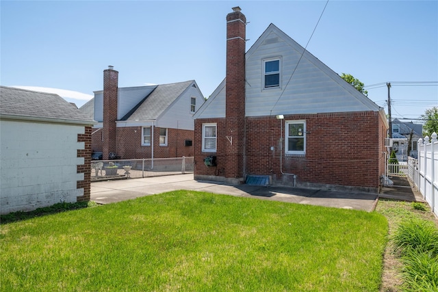 8123 260th St, Glen Oaks, NY 11004 - back of house with brick siding and a chimney