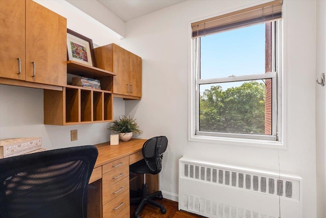 240 Garth Rd Unit 3L2, Scarsdale, NY 10583 - home office featuring radiator heating unit and dark wood-style flooring