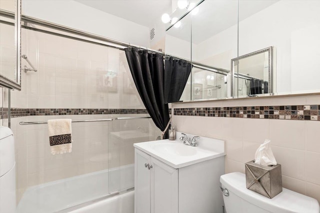 240 Garth Rd Unit 3L2, Scarsdale, NY 10583 - bathroom with shower / bath combination with glass door, tile walls, and vanity
