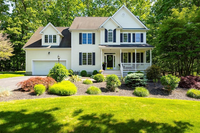 3 Cambridge Ct, Wappingers Falls, NY 12590 - colonial inspired home featuring a porch, a front lawn, driveway, and an attached garage