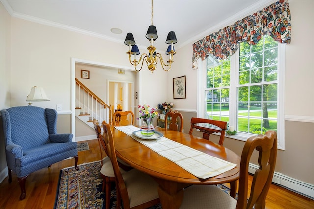 3 Cambridge Ct, Wappingers Falls, NY 12590 - dining area with a chandelier, wood finished floors, stairs, ornamental molding, and baseboards