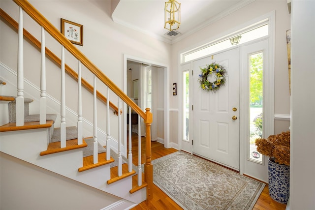 3 Cambridge Ct, Wappingers Falls, NY 12590 - entrance foyer with crown molding, stairway, and wood finished floors