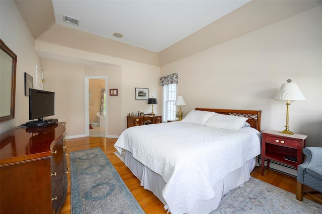 3 Cambridge Ct, Wappingers Falls, NY 12590 - bedroom with baseboard heating, light wood finished floors, and baseboards