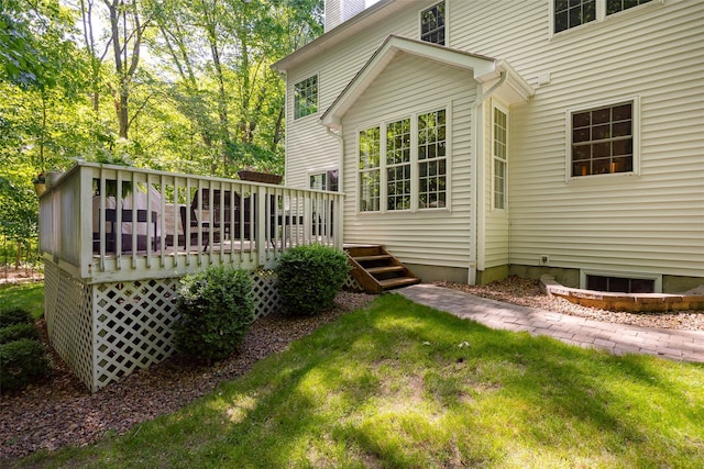 3 Cambridge Ct, Wappingers Falls, NY 12590 - rear view of property featuring a deck, a chimney, and a lawn