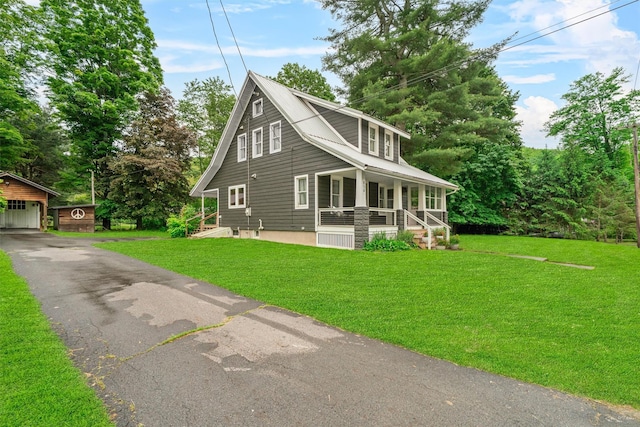 858 N Branch Hortonville Rd, North Branch, NY 12745 - view of side of home with covered porch, an outbuilding, a lawn, and a garage