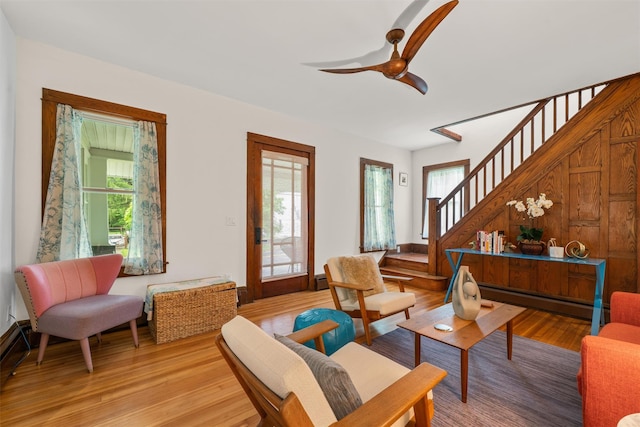 858 N Branch Hortonville Rd, North Branch, NY 12745 - living room featuring stairs, light wood-style flooring, plenty of natural light, and a baseboard heating unit