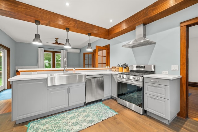 858 N Branch Hortonville Rd, North Branch, NY 12745 - kitchen featuring stainless steel appliances, wall chimney range hood, a sink, gray cabinets, and beam ceiling