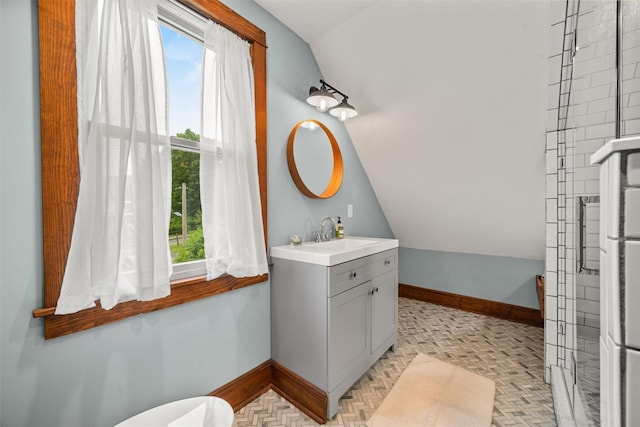 858 N Branch Hortonville Rd, North Branch, NY 12745 - bathroom with lofted ceiling, healthy amount of natural light, baseboards, vanity, and toilet