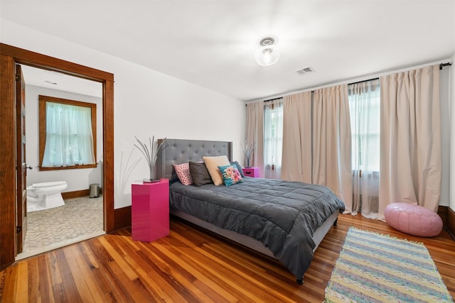 858 N Branch Hortonville Rd, North Branch, NY 12745 - bedroom with wood finished floors, ensuite bathroom, and baseboards