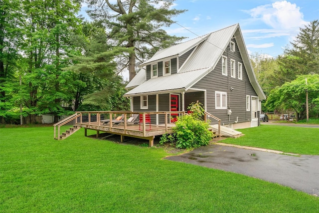 858 N Branch Hortonville Rd, North Branch, NY 12745 - view of front of property featuring metal roof, a deck, and a front yard