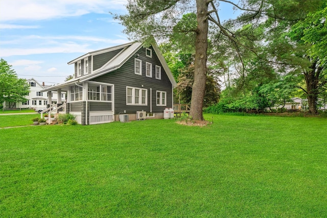 858 N Branch Hortonville Rd, North Branch, NY 12745 - back of house featuring a sunroom and a yard