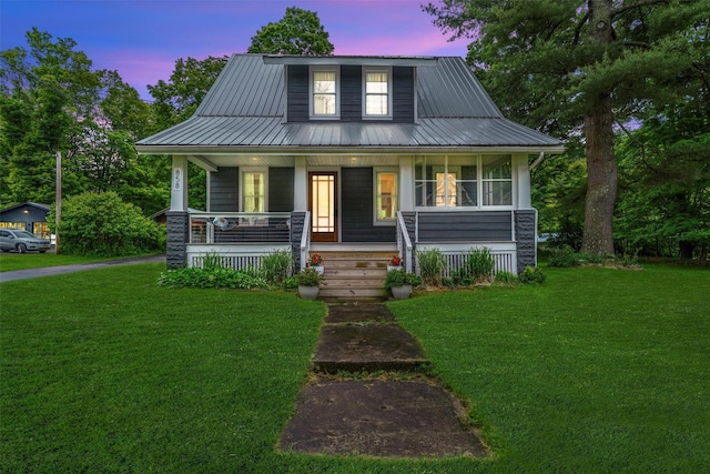 858 N Branch Hortonville Rd, North Branch, NY 12745 - view of front of house with a porch, a lawn, and metal roof