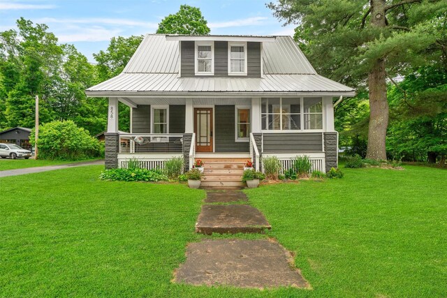 858 N Branch Hortonville Rd, North Branch, NY 12745 - view of front of house featuring covered porch, a front lawn, and a metal roof