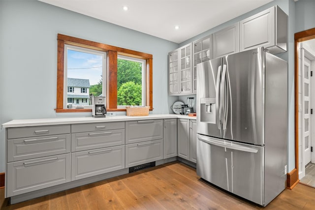 858 N Branch Hortonville Rd, North Branch, NY 12745 - kitchen with stainless steel fridge with ice dispenser, gray cabinetry, light wood-style floors, and recessed lighting
