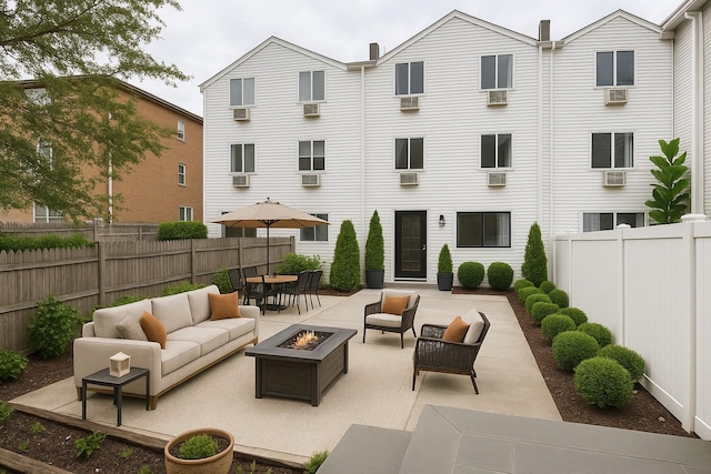 3665 Varian Ave, Bronx, NY 10466 - fenced backyard featuring an outdoor living space with a fire pit and a patio area
