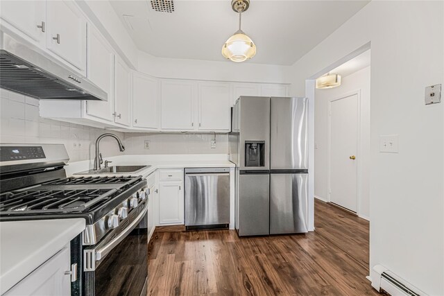 3665 Varian Ave, Bronx, NY 10466 - kitchen with stainless steel appliances, baseboard heating, under cabinet range hood, white cabinets, and light countertops
