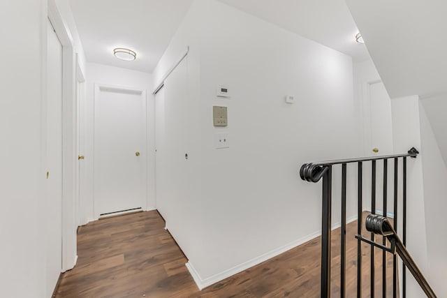 3665 Varian Ave, Bronx, NY 10466 - hallway featuring dark wood-type flooring, an upstairs landing, and baseboards