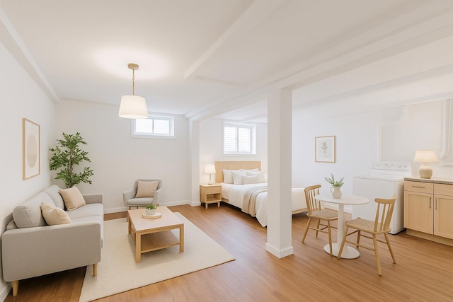 3665 Varian Ave, Bronx, NY 10466 - bedroom with washer / clothes dryer, light wood finished floors, and baseboards