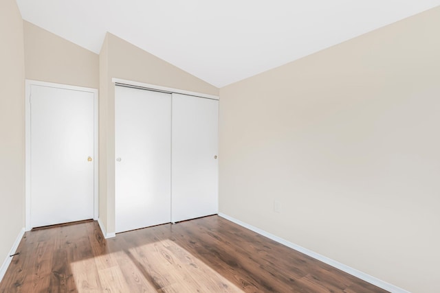 3665 Varian Ave, Bronx, NY 10466 - unfurnished bedroom with lofted ceiling, wood finished floors, baseboards, and a closet