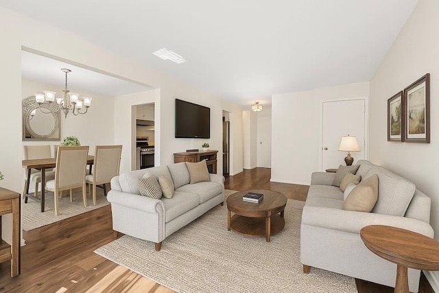 3665 Varian Ave, Bronx, NY 10466 - living area featuring wood finished floors and a chandelier