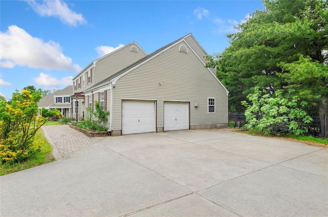 49 Tallmadge Trl, Miller Place, NY 11764 - view of home's exterior with driveway and a garage