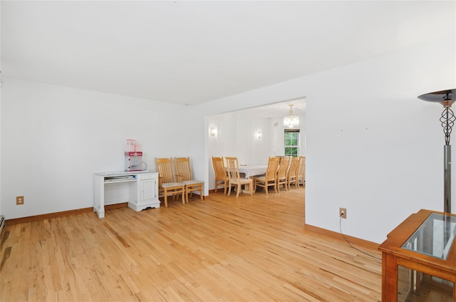 49 Tallmadge Trl, Miller Place, NY 11764 - sitting room featuring light wood-type flooring, baseboards, and a chandelier