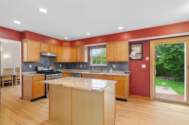 49 Tallmadge Trl, Miller Place, NY 11764 - kitchen with appliances with stainless steel finishes, under cabinet range hood, light wood-type flooring, a sink, and recessed lighting