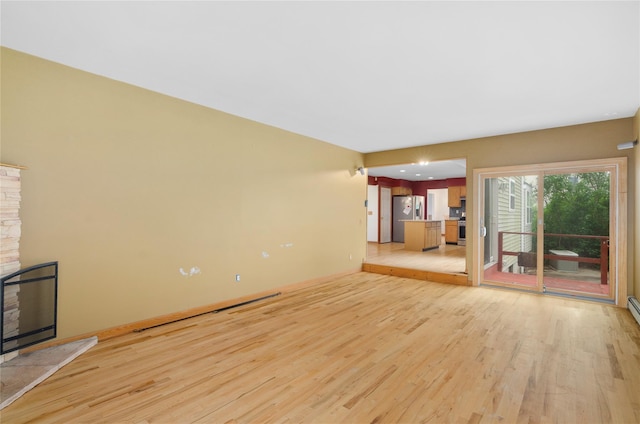 49 Tallmadge Trl, Miller Place, NY 11764 - unfurnished living room with light wood-type flooring and baseboards