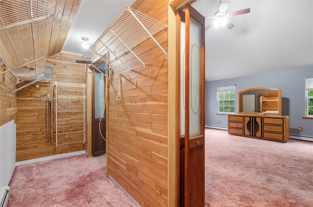 49 Tallmadge Trl, Miller Place, NY 11764 - walk in closet with vaulted ceiling, carpet, a baseboard heating unit, and a ceiling fan