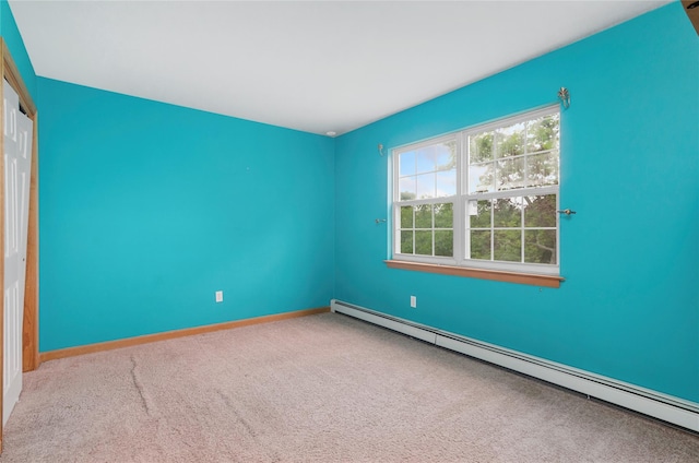 49 Tallmadge Trl, Miller Place, NY 11764 - unfurnished bedroom with a baseboard heating unit, carpet flooring, a closet, and baseboards