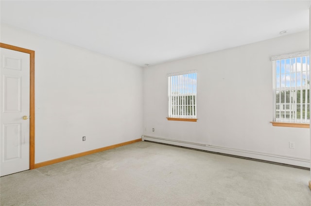 49 Tallmadge Trl, Miller Place, NY 11764 - carpeted empty room featuring plenty of natural light, a baseboard heating unit, and baseboards