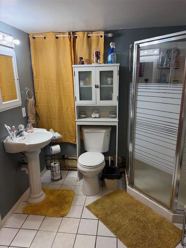 27 Pandora Dr, Brentwood, NY 11717 - full bath with a stall shower, tile patterned floors, and toilet