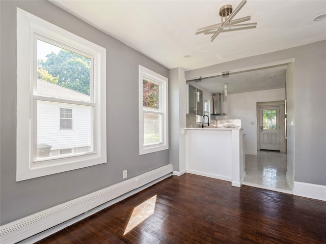 34 Woodland Ave, Poughkeepsie, NY 12603 - unfurnished living room with baseboards and dark wood finished floors