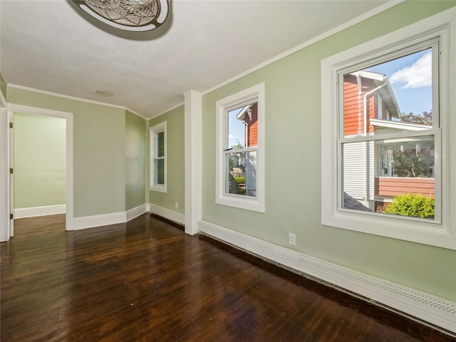 34 Woodland Ave, Poughkeepsie, NY 12603 - empty room with a baseboard heating unit, dark wood finished floors, baseboards, and crown molding